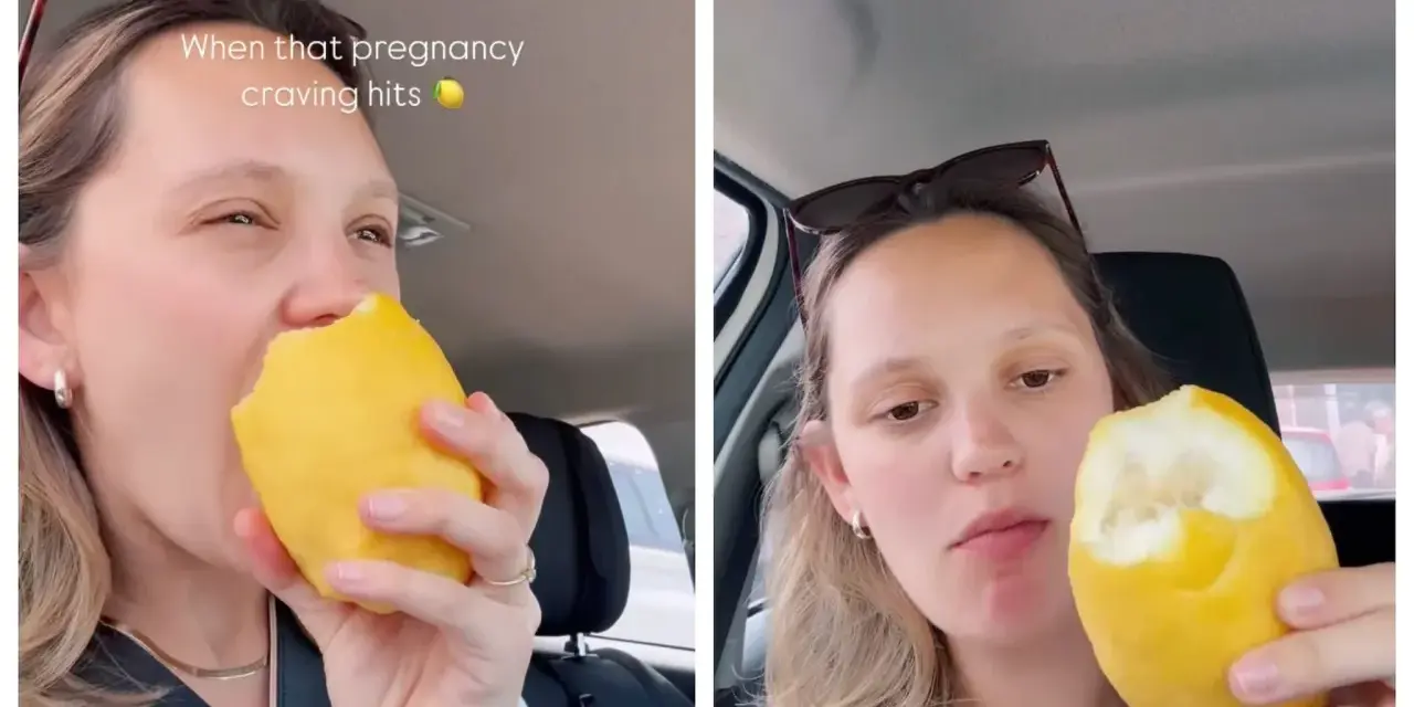 Donna incinta morde un limone intero, soddisfando una strana voglia.