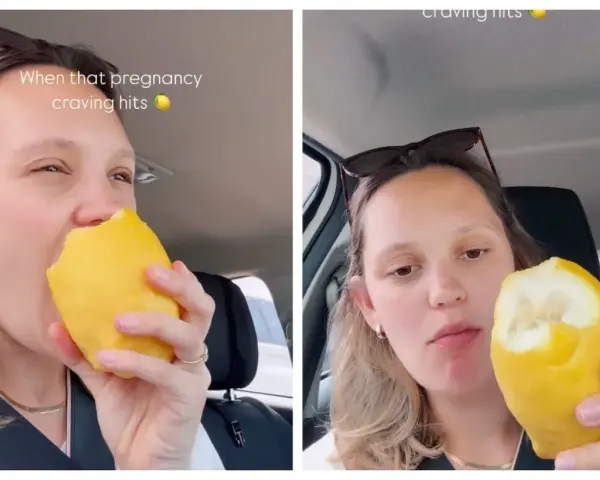 Donna incinta morde un limone intero, soddisfando una strana voglia.