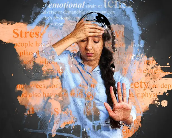 Donna con mano sulla fronte, circondata da parole come "stress" e "ansia", che suggeriscono esaurimento nervoso sintomi.