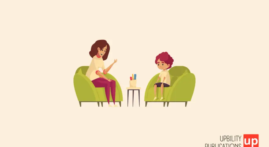 Una psicologa parla con un bambino di 6-7 anni seduti su poltrone verdi.
